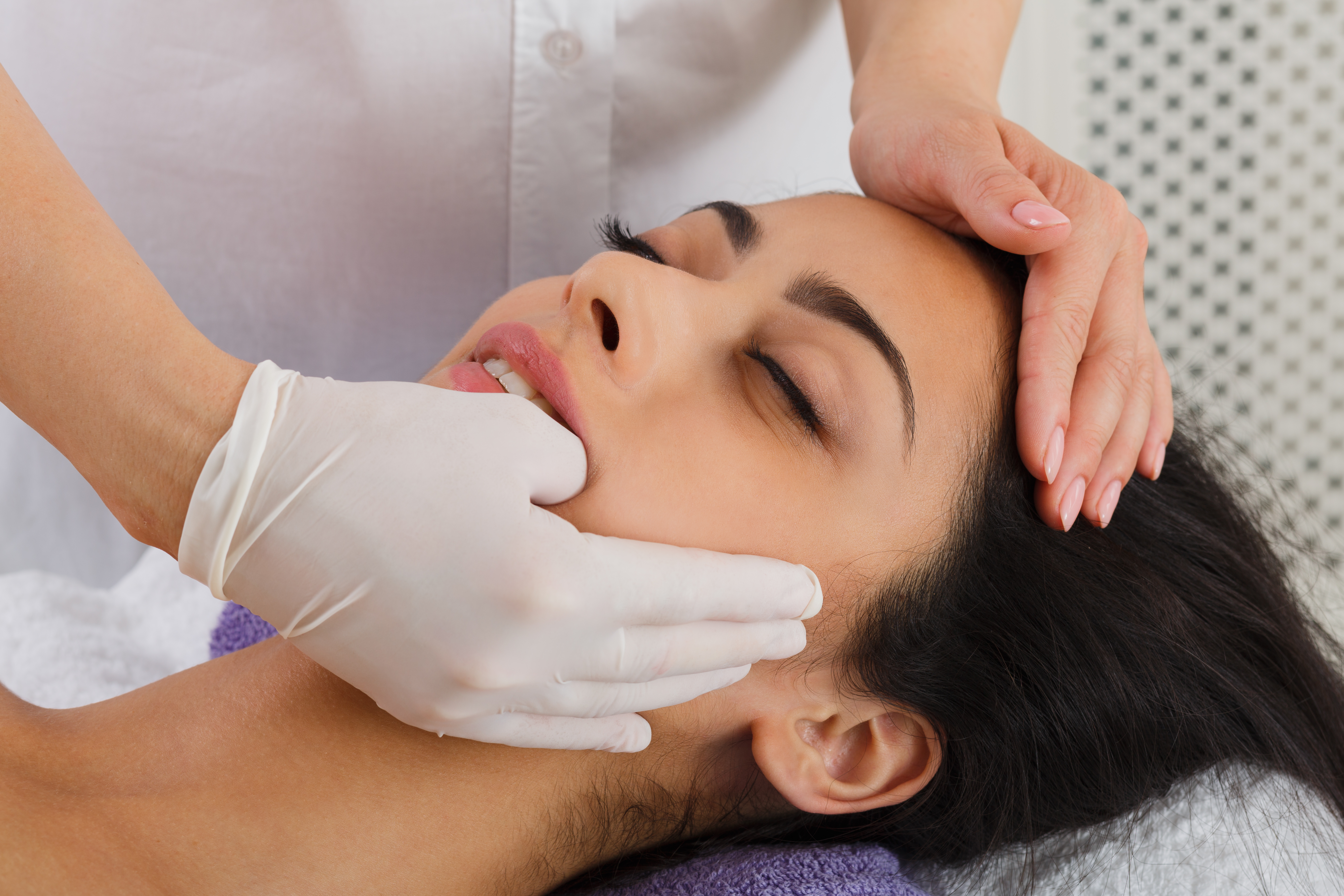 Hands-on TMJ chiropractic treatment