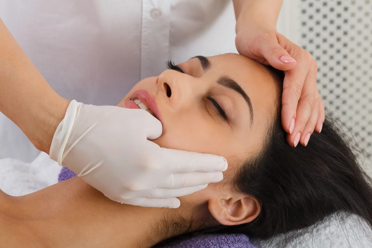 Hands-on TMJ chiropractic treatment